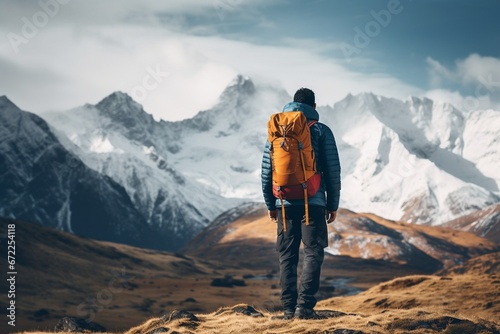 Facing the Snow-Covered Mountain Challenge: Man with Backpack