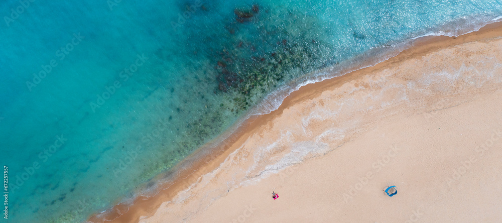 View from above to lonely people on the big beach