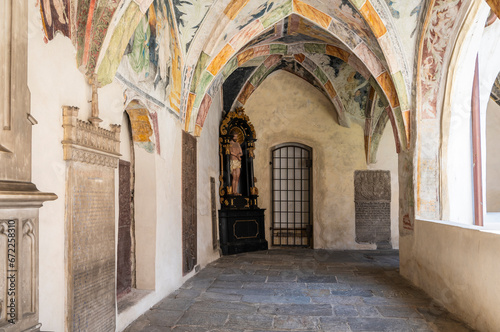 Novacella Augustinian Abbey. The Gothic cloister with from valuable frescoes, Brixen (Bressanone), South Tyrol, northern Italy, Juni 12, 2023 © lorenza62
