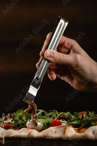 cooked delicious pizza on the table, serving pizza in a restaurant, photo of pizza for advertising, photo of pizza for printing