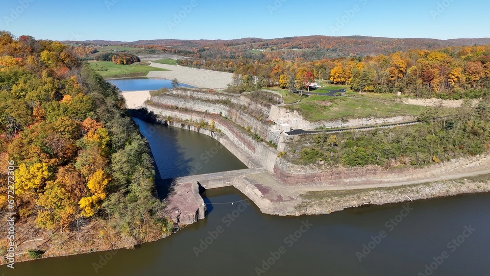 Hammond-Lakes Dam and Reservoir in Tioga, Pennsylvania peaceful lake and water in Autumn Fall colors in mountain trees in morning sunlight where boating and fishing is permitted