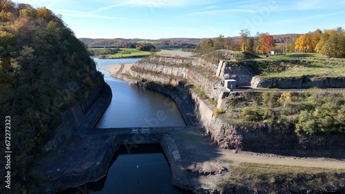 Hammond-Lakes Dam and Reservoir in Tioga, Pennsylvania peaceful lake and water in Autumn Fall colors in mountain trees in morning sunlight where boating and fishing is permitted