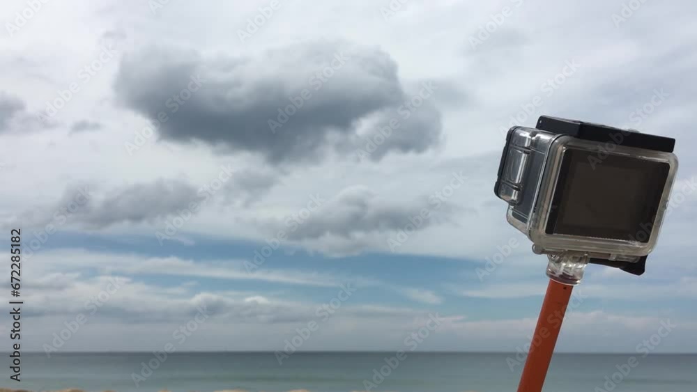 Action camera in front of beautiful beach Action camera in front of beautiful beach