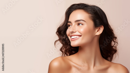 Brunette woman beauty model in front of pastel pink background. Facial skincare and makeup banner. photo