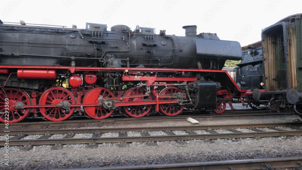 Steam locomotive driving on old railroad station area Steam locomotive driving on old railroad station area