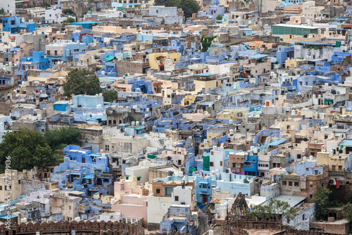 Aerial view of the blue city from Mehrangarh Fort in Jodhpur in Rajasthan, India. on a cloudy day © angel