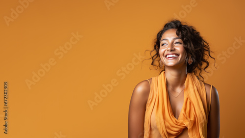Indian woman model wear orange sundress isolated on pastel background