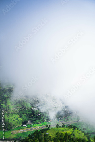 Airport of hilly region of Nepal Bajhang Farwest Nepal  Landscape with fog and cloud