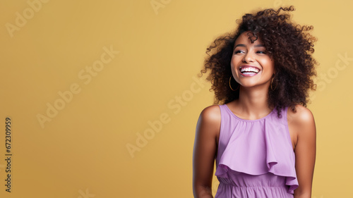 Afro-american woman model wearing a purple sundress isolated on pastel