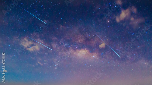 Panorama blue night sky milky way and star on dark background.Universe filled with stars, nebula and galaxy with noise and grain.Photo by long exposure and select white balance.Dark night sky.