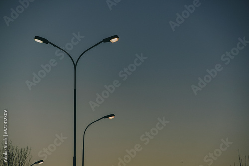 Low angle view of street lights against sky