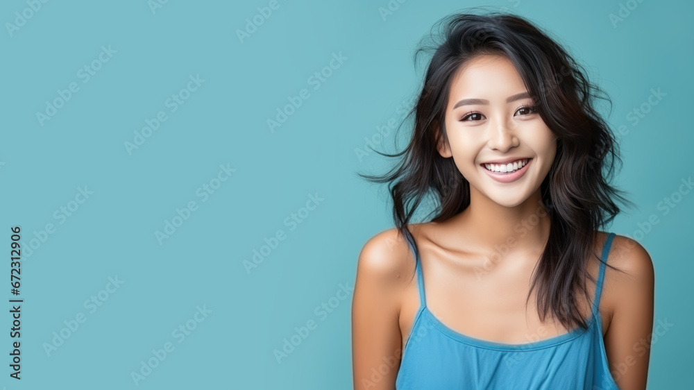 Asian woman model wear a blue sundress isolated on pastel background Asian woman model wear a blue sundress isolated on pastel background