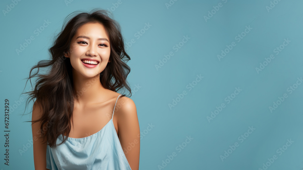 Asian woman model wear a blue sundress isolated on pastel background Asian woman model wear a blue sundress isolated on pastel background