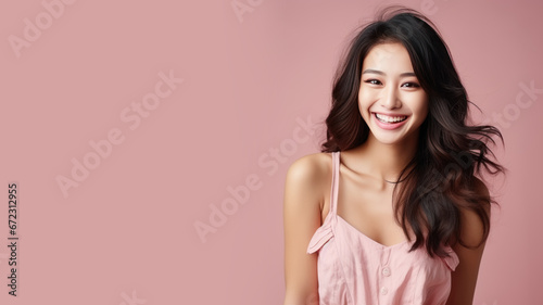 Asian woman model wear a pink sundress isolated on pastel background