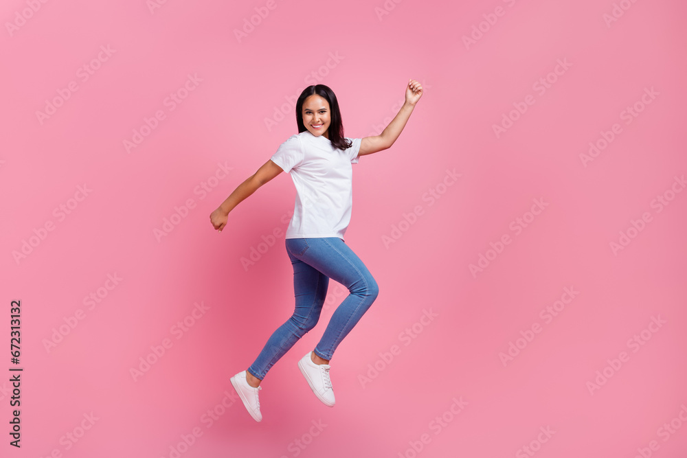 Full body size photo of crazy carefree young woman running escape high prices in shopping mall isolated over pink color background