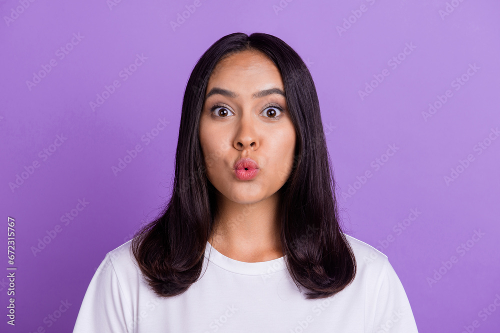 Fototapeta premium Closeup portrait of nice attractive lovely charming woman blow air plump lips sending air kiss isolated on violet color background