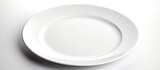An isolated white background showcases a plate displaying an empty dish