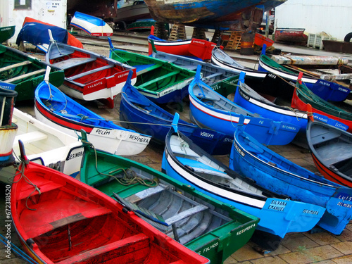 Sesimbra, Portugal. Traditional fishing boats, called Aiolas at the fishing harbor of Sesimbra, Setubal District photo