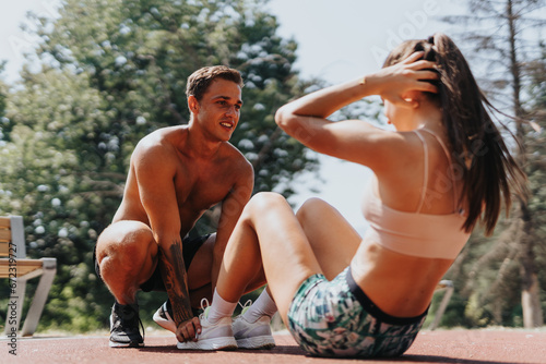 Sporty Couple Enjoying Outdoor Training in the Park, Building Strong and Fit Bodies