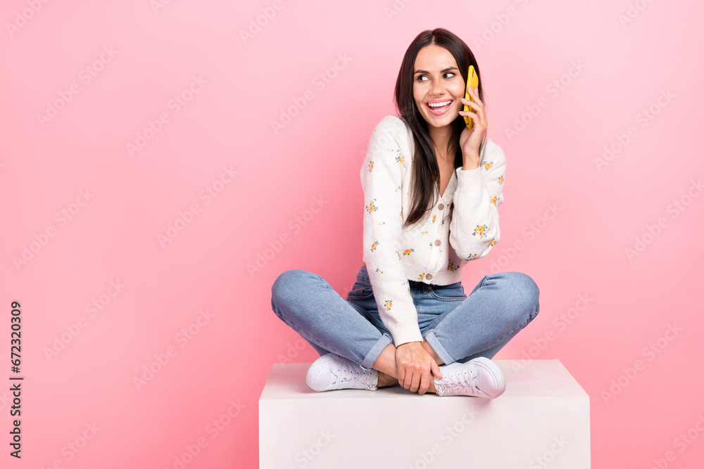Full length photo of dreamy thoughtful woman dressed white shirt talking modern gadget looking empty space isolated pink color background Full length photo of dreamy thoughtful woman dressed white shirt talking modern gadget looking empty space isolated pink color background
