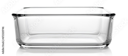 A clear baking dish devoid of contents sits alone on a white backdrop photo