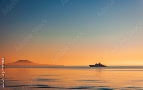 Silhouette of a luxurious yacht on the sea of cortez  at sunset