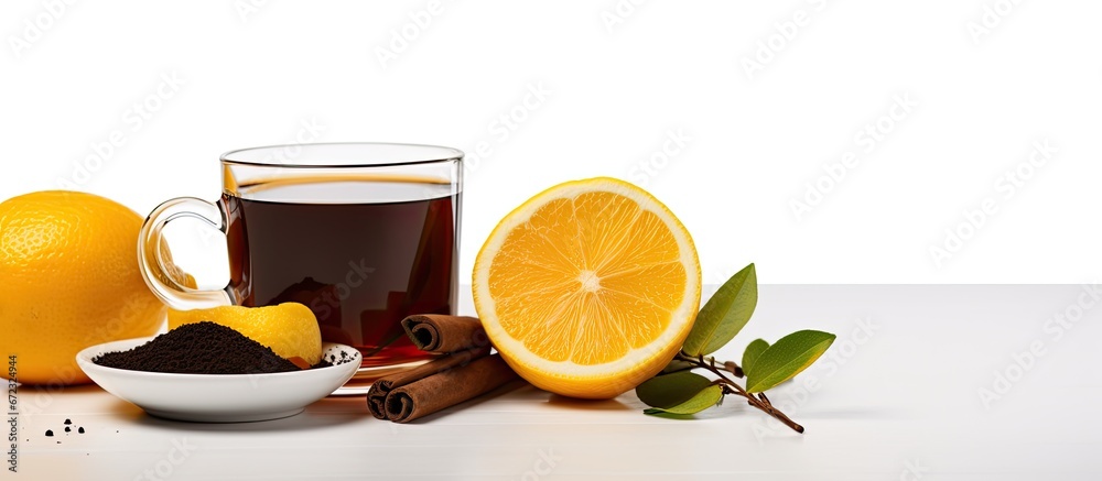 A white backdrop softly illuminates a cup of black tea blended with lemon A white backdrop softly illuminates a cup of black tea blended with lemon