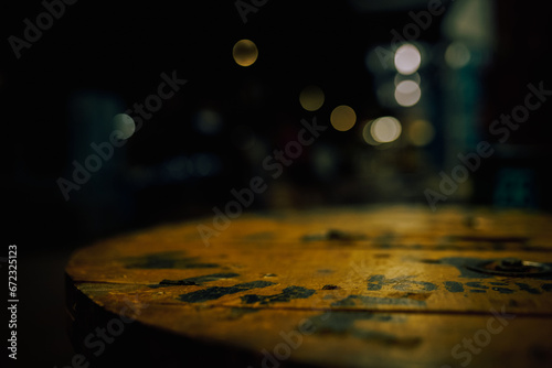 Empty wooden surface in the night lights