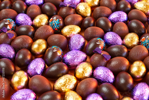 Small Chocolate Easter Eggs Decorated and Wrapped in Gold and Purple Foil