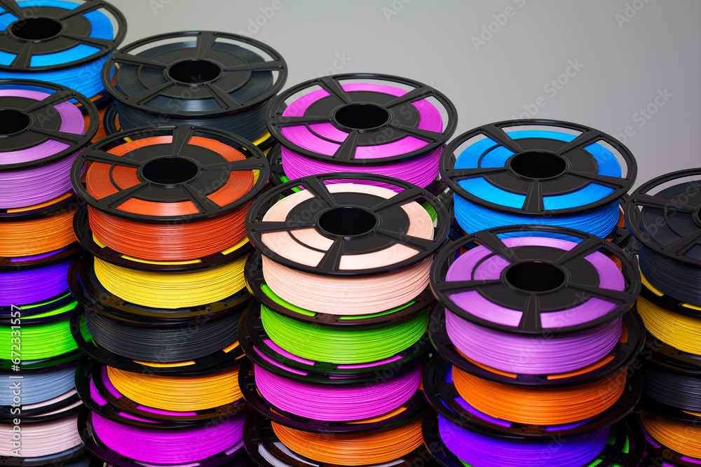 Multicoloured filaments spools of plastic for 3D printer. 3D printing technology