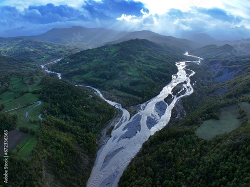 A panoramic aerial view of the Enza River near the village of Vetto d'Enza and the Vetto Dam. Reggio Emilia, Emilia Romagna, Italy