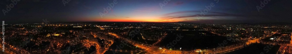 Aerial panoramic view of sunset over the bustling city