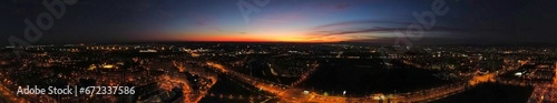 Aerial panoramic view of sunset over the bustling city