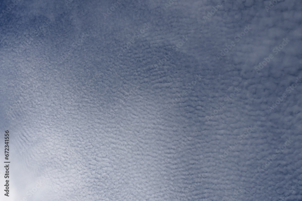 Natural sky with billowing clouds against a backdrop of vibrant blue. Natural sky with billowing clouds against a backdrop of vibrant blue.
