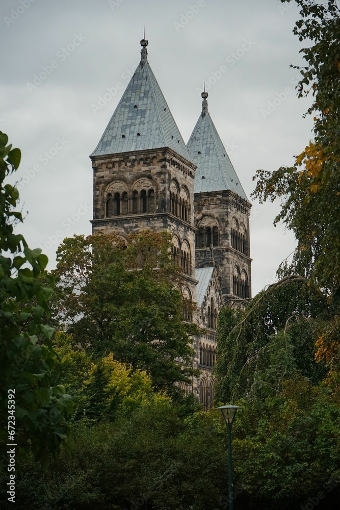 Domebof Lund Cathedral above the trees in a picturesque public park