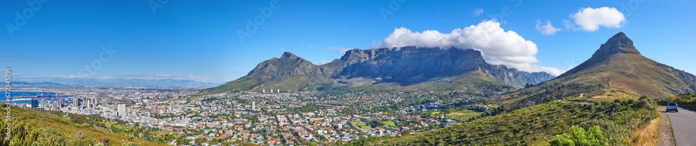 Wide angle of Cape Town and mountain landscape on a sunny day. Panoramic view of a city against a blue horizon. A popular travel destination for tourists and hikers, in Lions Head, South Africa