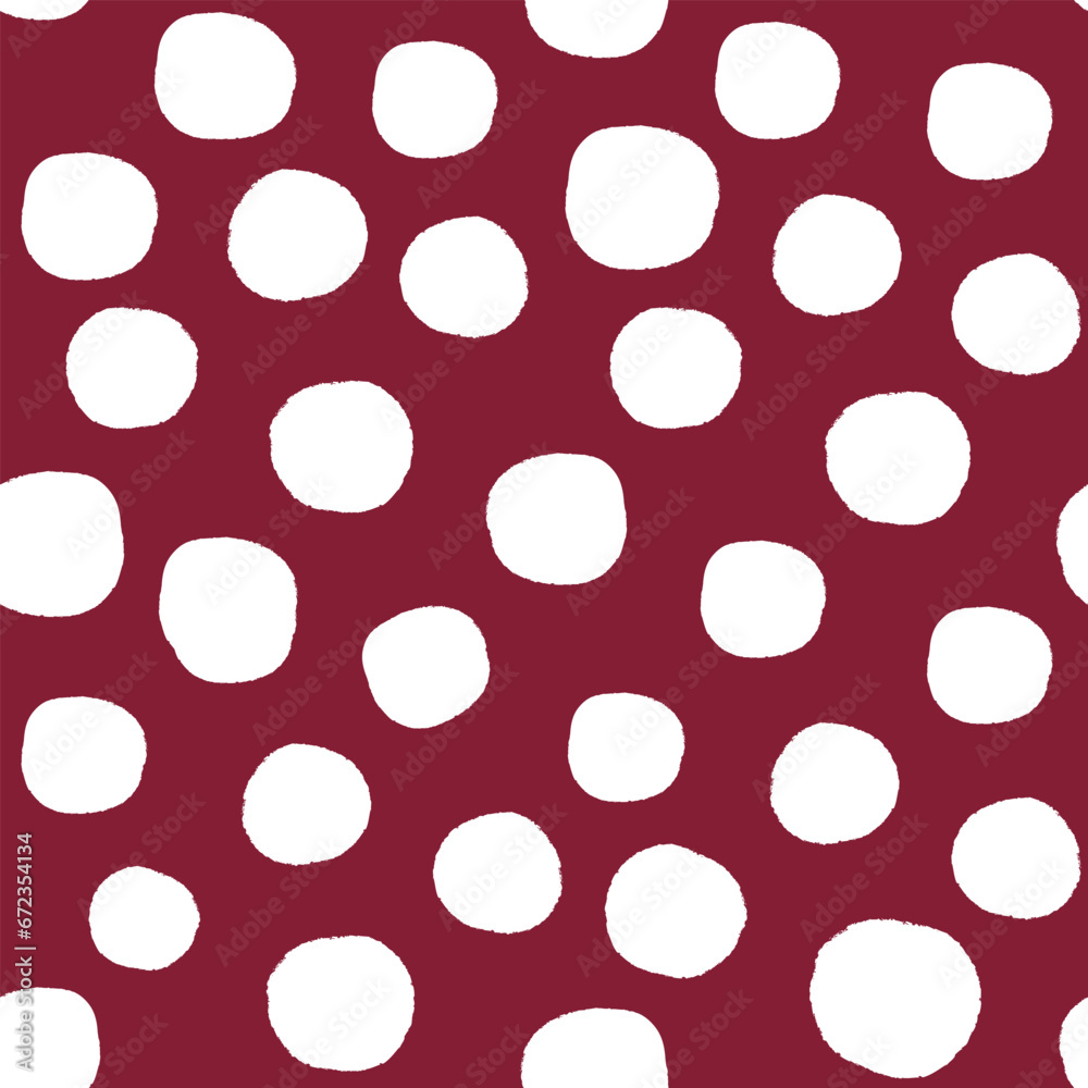 All over seamless repeat pattern with hand drawn irregular white polka dot on deep burgundy maroon. Traditional trendy modern xmas background with tossed dots