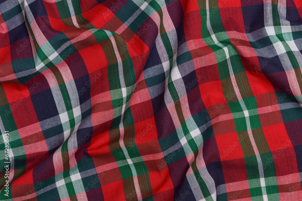 Texture of crumpled red and blue tartan fabric close-up. the concept of traditional Swedish clothing. images for your design