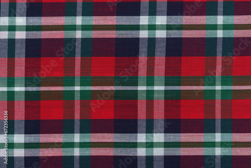Close-up of a traditional Scottish tartan in red, blue and green colors. Image for your design