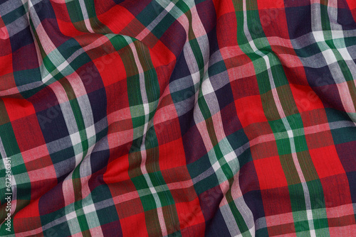 Texture of crumpled red and blue tartan fabric close-up. the concept of traditional Swedish clothing. images for your design