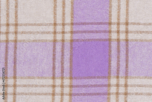 Close-up of the traditional Scottish fabric design in a cell of purple and milky colors. Picture for your design