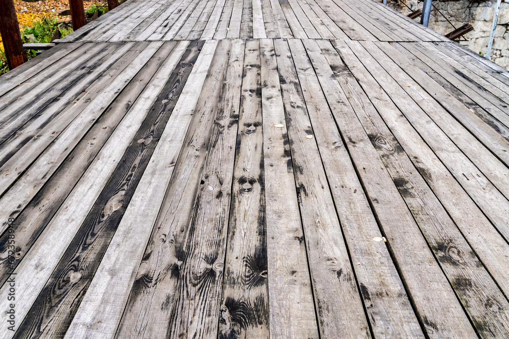 Old boards, bridge over the river. Texture.
