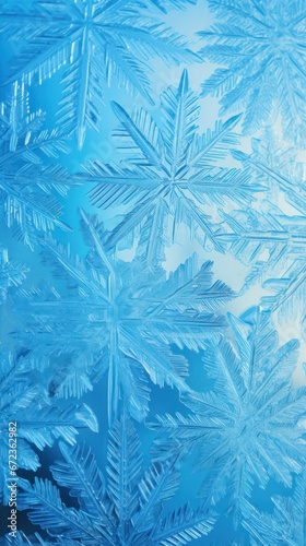 Close-up of intricate ice crystals forming a mesmerizing symmetrical pattern on a blue background