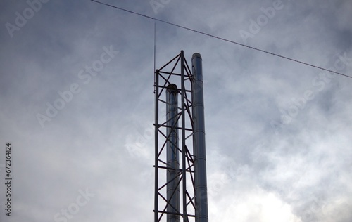 heating tube tower against sky