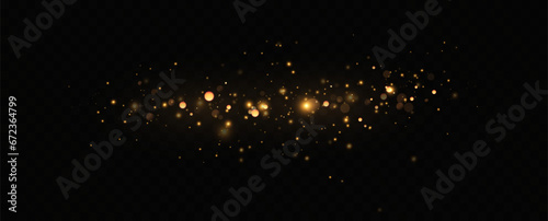 Golden sequins glow with many lights. Glittering dust. Luxurious background of golden particles.	