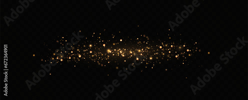 Golden sequins glow with many lights. Glittering dust. Luxurious background of golden particles.	