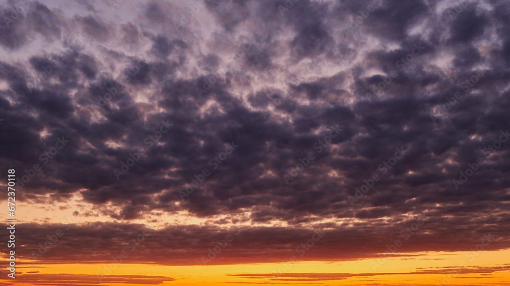 The evening sky was a canvas of oranges and reds, reflecting the fading light. The evening sky transforms into a canvas of darkness as the sun disappears below the horizon