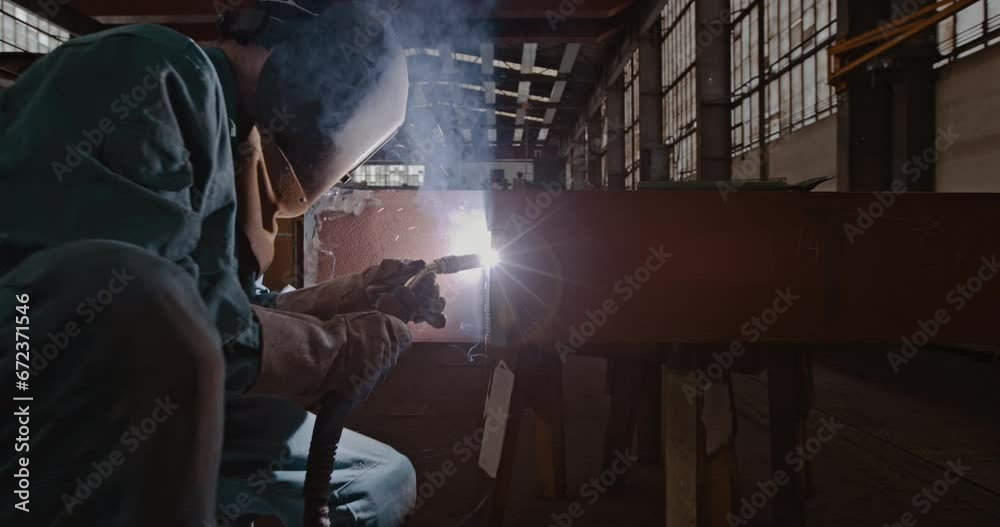 Mechanic welding while in warehouse
