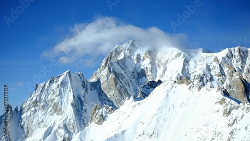 Aerial view of the majestic Monte Bianco mountain range, featuring a stunning winter landscape