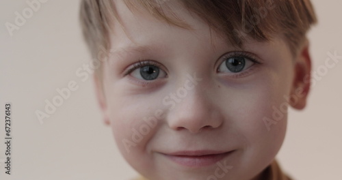 Portrait of a little boy with a soft toy in his hands. Shooting in the studio